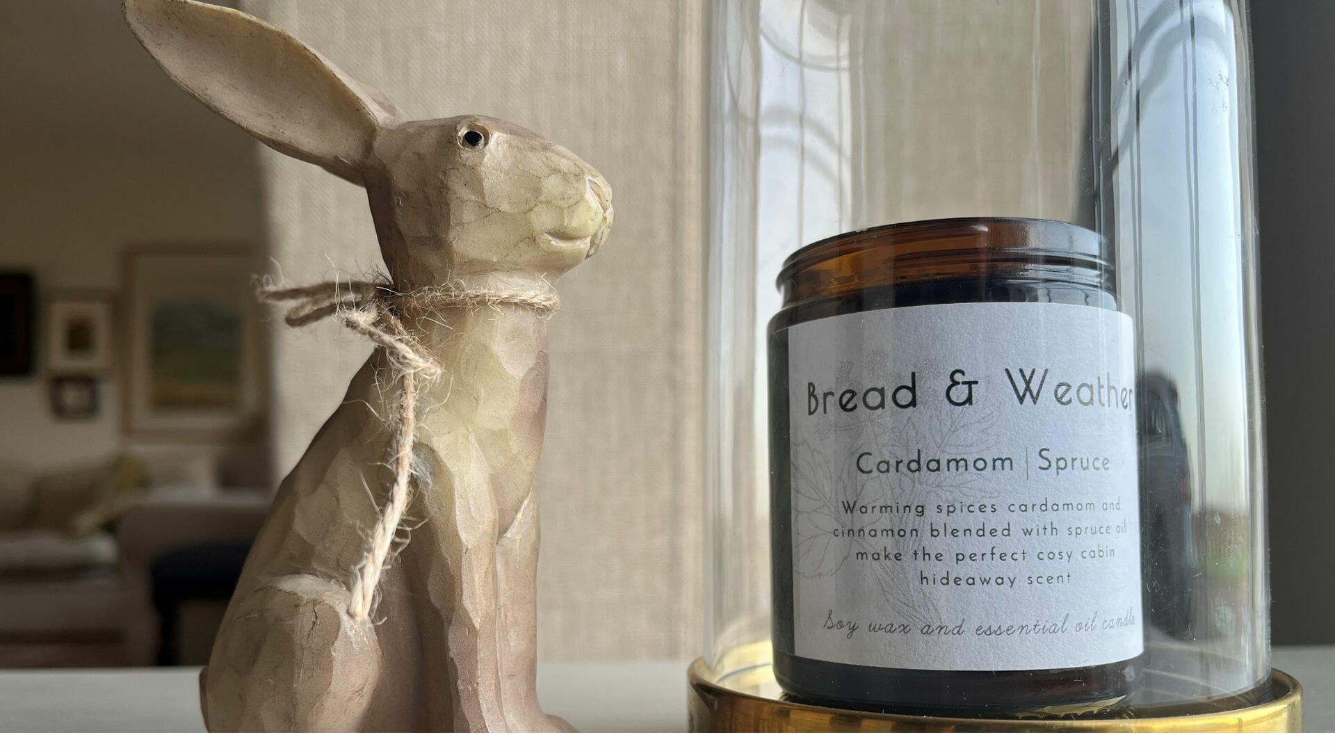 Candle in glass dome with wooden hare
