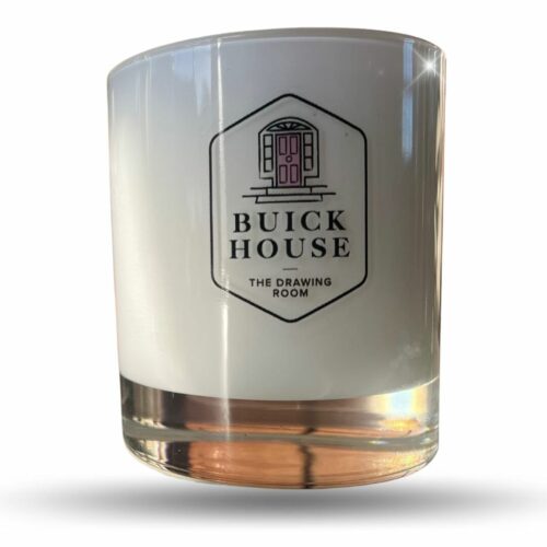 White glass scented candle called Buick House