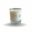 Clear glass jar with white label containing a soy wax candle.